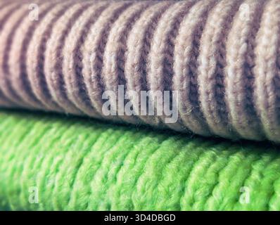 contrast of green and beige ribbed knitted wool fabric macro texture Stock Photo