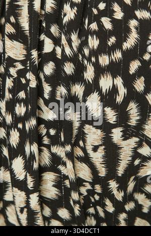 Black Textile Background with Abstract Beige Dots and Strokes Stock Photo