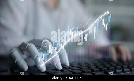 A robotic hand interacts with financial data on a keyboard, representing the integration of technology and finance. The image illustrates growth Stock Photo