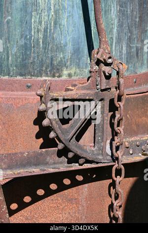 Detail of Old Rusty Cog, Cogwheel, Gear or Toothed Wheel of Vintage Lavender Still or Alembic Stock Photo