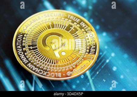 KYIV, UKRAINE - OCTOBER 9, 2025 Polkadot cryptocurrency coin sticker on blue candles chart banner. Concept of modern crypto money Stock Photo