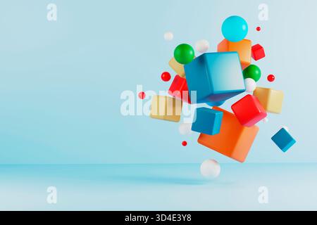 3D render of bright cubes and spheres suspended over a light blue studio floor. No people. Playful abstract scene with copy space. Stock Photo