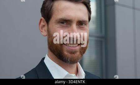Portrait positive smiling business man Caucasian mature businessman smile toothy looking at camera in city male specialist entrepreneur enjoying Stock Photo