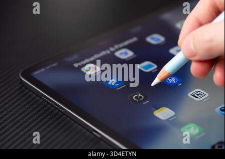 New York, USA - November 7, 2025: Open on tablet Grok AI app  close up view on dark table Stock Photo