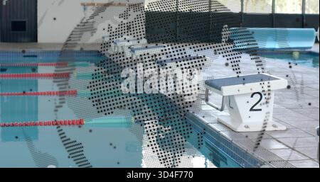Sitting white starting block number 2 on coping beside pool with red lane ropes, copy space Stock Photo