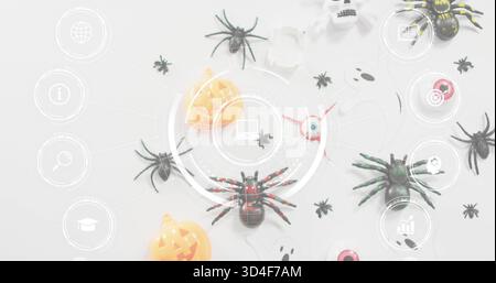 Showing red-accented black toy spider sitting centered on pale table, with Halloween props and HUD Stock Photo