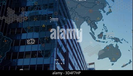 Displaying glass tower at street level reflecting windows and showing Asia map overlay, hex grid Stock Photo