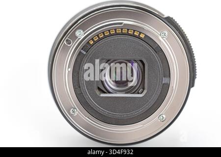 Close-up of a dusty camera lens mount with visible scratches and electronic contacts, showcasing the fine metal details, precision, and craftsmanship Stock Photo