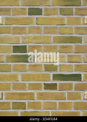 Yellow and green brick wall with bright mortar and modern color contrast. Copyspace. Stock Photo