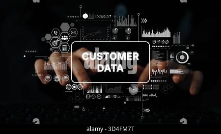 Conceptual representation of customer data management with analytics and charts overlaid on a dark background with hands typing on a keyboard Stock Photo