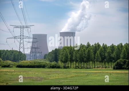 View on cooling towers of NPP, nuclear power plant thermal power station in which heat source is nuclear reactor, France, Europe, cheap energy source, Stock Photo