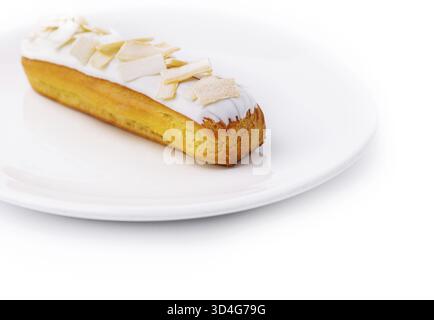 Food, Eclair with white chocolate on white plate Stock Photo