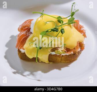 Food, Egg benedict with hollandaise sauce and smoked salmon on toast Stock Photo