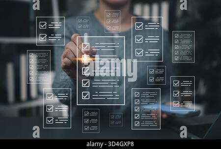 Digital checklist management concept. Businesswoman using virtual touchscreen interface to mark tasks, representing productivity, workflow planning, Stock Photo