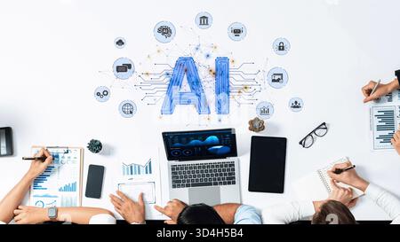 Team members work together on artificial intelligence project, utilizing data analysis tools and innovative concepts in a modern office environment Stock Photo