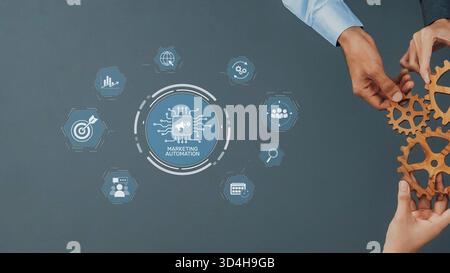 Visual representation of marketing automation with hands holding gears, illustrating collaboration and technology solutions for effective business Stock Photo