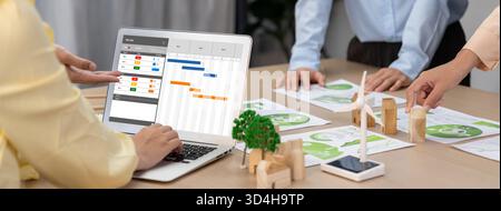 Project planning software for brisk business project management on the computer screen showing timeline chart of the team project Stock Photo