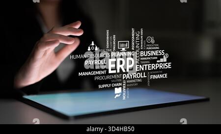 Dynamic image showing a hand reaching for a digital screen displaying a word cloud representing ERP solutions, emphasizing business management Stock Photo