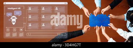 A team engages in a collaborative effort to strategize human resources solutions using digital tools. The image illustrates the fusion of technology Stock Photo