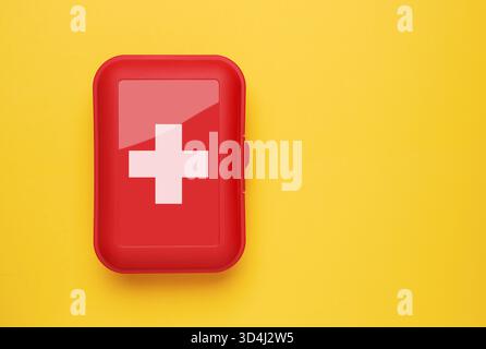 First Aid Kit on yellow background Stock Photo