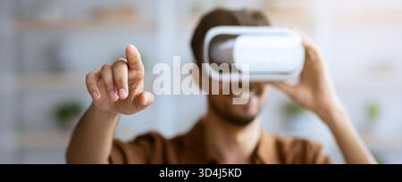 Engaging Experience With Virtual Reality Headset in a Bright, Modern Space Stock Photo