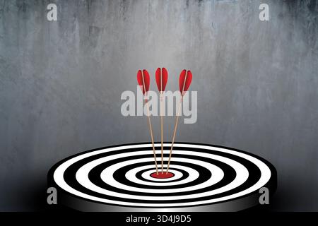 Three red arrows perfectly hitting the center of a black and white target on concrete background, representing precision, success, accuracy, leadershi Stock Photo