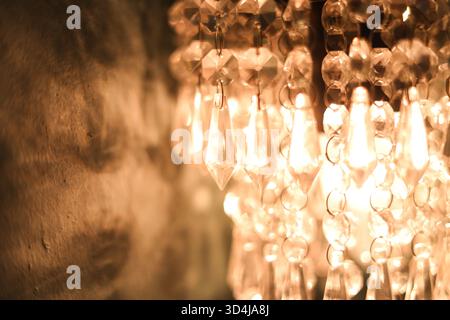 Close-up of a Vintage Chandelier Glowing Under Warm Incandescent Lights Stock Photo