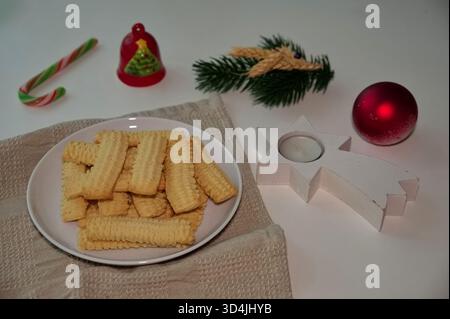 Biscuits on the plate with Christmas ornaments Stock Photo