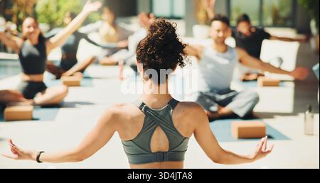 Back, meditation and yoga instructor outdoor for teaching class, demonstration or lesson to students. Fitness, wellness or zen and personal trainer in Stock Photo