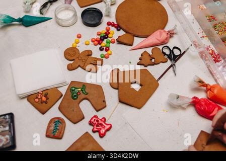 kids making gingerbread men and gingerbread house during the holidays. High quality photo Stock Photo