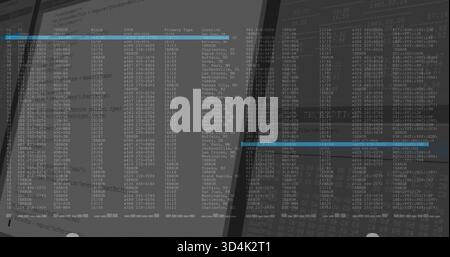 Displaying two angled computer monitors showing terminal tabular text at desk, with blue bars Stock Photo