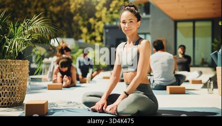 Portrait, relax and yoga instructor outdoor for teaching class, demonstration or retreat for students. Exercise, wellness or zen and personal trainer Stock Photo