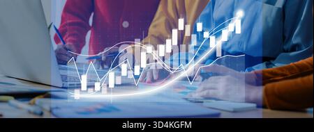 Business professionals collaborating in an office environment, focusing on financial growth, data analysis, and strategic planning through visual aids Stock Photo