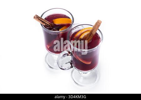Mulled Wine with Orange and Cinnamon Sticks and Christmas decoration isolated on white background Stock Photo