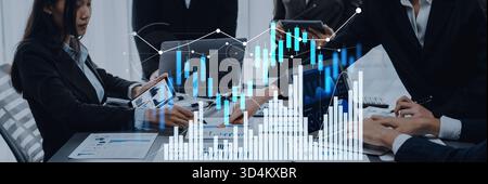 A dynamic business meeting scene featuring professionals discussing financial data and growth trends, highlighted by digital graphs and charts in a Stock Photo