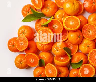 Sliced Mandarin oranges on a white background Stock Photo