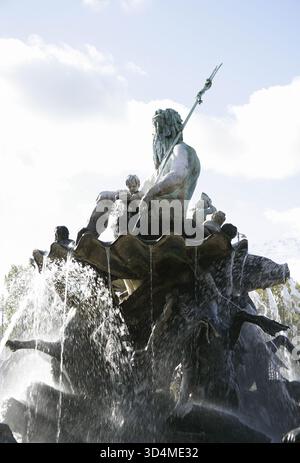 Neptune, Roman god of rivers and the sea, holding a trident and riding ...
