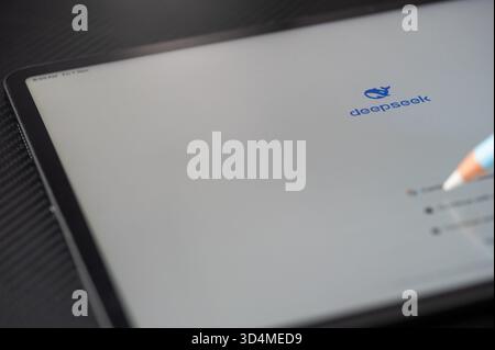 New York, USA - November 7, 2025: Login on tablet to Deepseek AI app  close up view on dark table Stock Photo