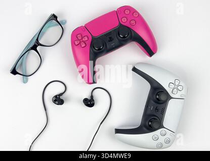 A flat lay composition combining items related to productivity/scheduling and gaming/leisure. Stock Photo