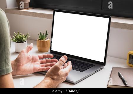 Man using laptop computer for video conference call at home, mockup screen for app interface or online communication concept, digital connection and v Stock Photo
