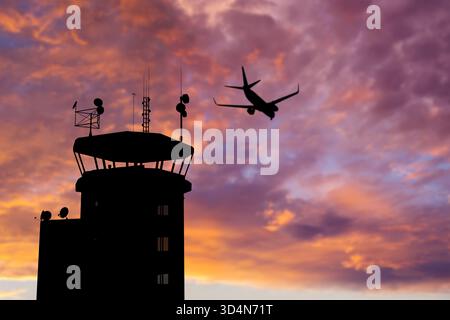 Air Traffic Control Tower at Airport As Airplane Takes Off. Stock Photo
