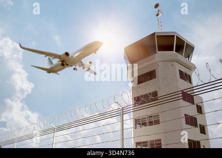 Air Traffic Control Tower at Airport As Airplane Takes Off. Stock Photo