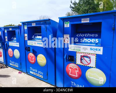 Clothes and Shoes Donation Bins - Textile Charity Drop Off Boxes. London, UK, 13 April 2024 Stock Photo
