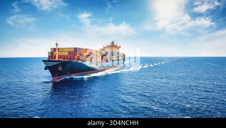 Aerial panorama of a cargo ship carrying container for import and export, business logistic and transportation in open sea with copy space Stock Photo