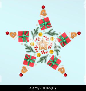 Star shape made of Christmas festive decor, gift boxes and cookies on light blue background Stock Photo
