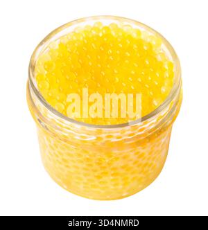 yellow caviar of river rainbow trout fish in glass jar from Armenia cutout on white background Stock Photo