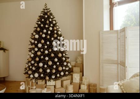 Beautifully decorated Christmas tree with many presents under it. Stock Photo