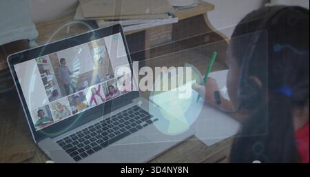 Writing kid at home wearing headphones using laptop HUD-overlay, green pencil and paper, copy space Stock Photo