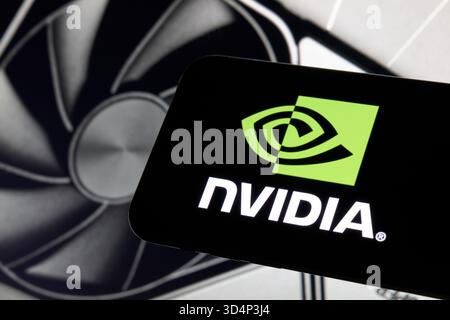 NVIDIA Logo Displayed on Smartphone with GeForce GPU Cooling Fan Stock Photo