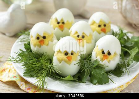 Food, Funny eggs chicks. Easter idea for breakfast. Healthy appetizer for easter table. selective focus Stock Photo